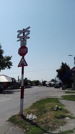 Road sign against clear sky