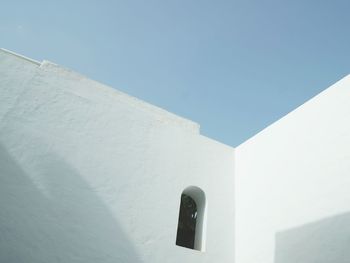 High section of house against clear blue sky