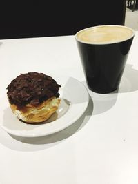 High angle view of coffee served on table