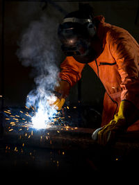 Man welding in workshop