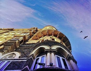 Low angle view of building against blue sky