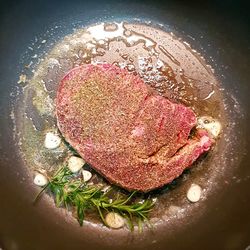 Close-up of meat in cooking pan