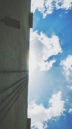 Low angle view of building against cloudy sky