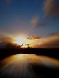 Scenic view of sunset over river