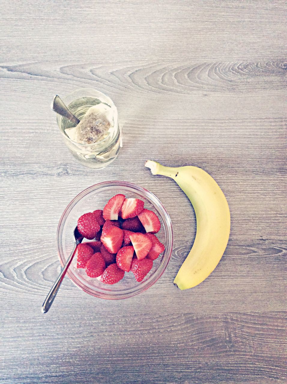 food and drink, freshness, table, food, still life, healthy eating, fruit, indoors, high angle view, drink, directly above, refreshment, wood - material, slice, close-up, bowl, plate, red, no people, ripe