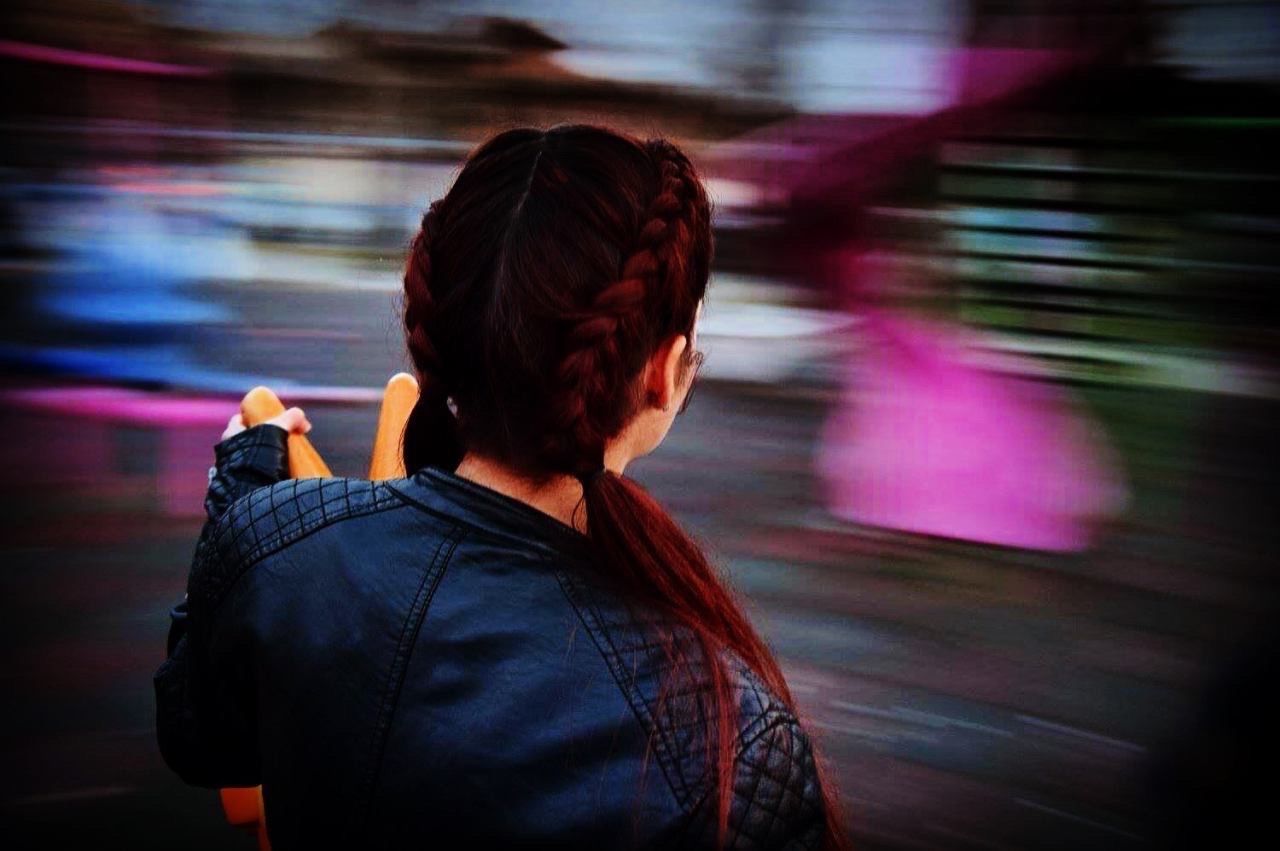 rear view, lifestyles, leisure activity, casual clothing, men, standing, focus on foreground, illuminated, night, person, waist up, transportation, blurred motion, three quarter length, side view, indoors, street, city life