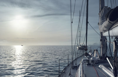 Cropped image of sailboat on mediterranean sea against sky