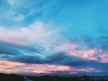 Low angle view of dramatic sky during sunset