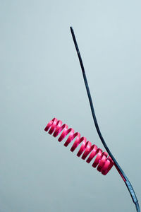 Low angle view of red object over white background