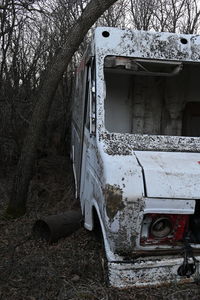 Abandoned car on field