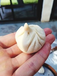 Close-up of hand holding ice cream