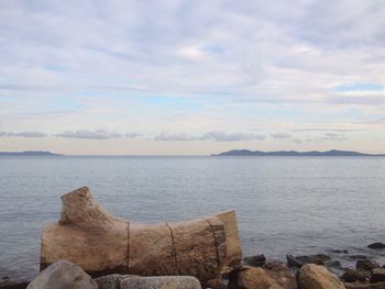 Scenic view of sea against cloudy sky