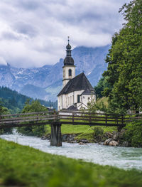 Church by mountain against sky