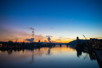 Pier on harbor against sky during sunset