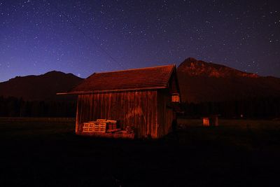 House against clear sky at night