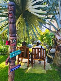 View of statues and palm trees in park