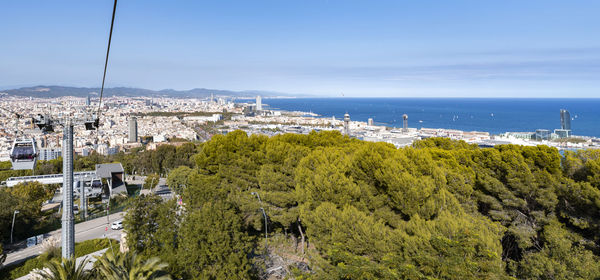 High angle view of trees and buildings against sky