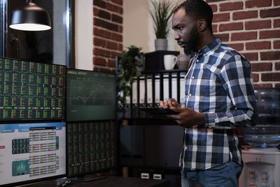 Businessman using digital tablet in office