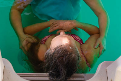 Directly above shot of women in swimming pool