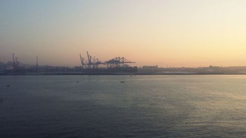 Scenic view of sea against clear sky during sunset