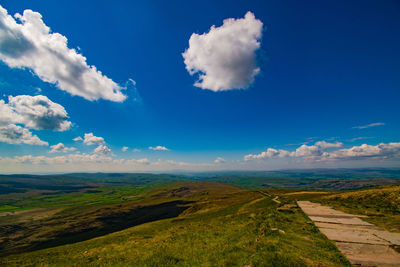 Scenic view of landscape against blue sky