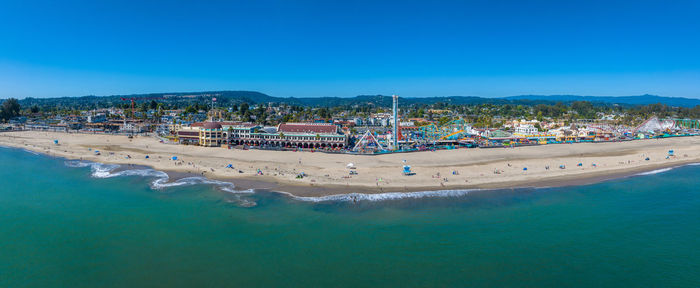 High angle view of sea against clear blue sky