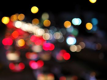 Defocused image of illuminated lights at night