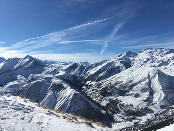 Scenic view of snowcapped mountains against sky