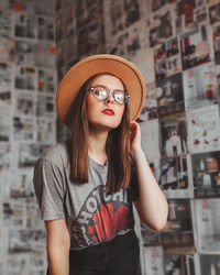 Portrait of beautiful young woman wearing hat