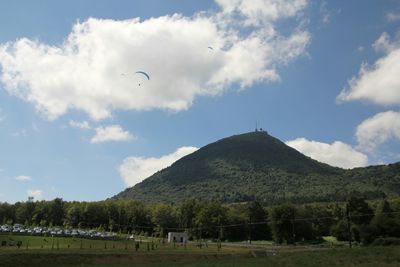 Scenic view of mountains against cloudy sky