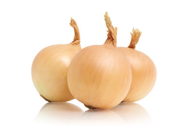 Close-up of pumpkins against white background