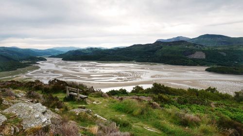 Scenic view of landscape and mountains against sky