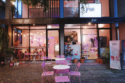 Chairs and tables in restaurant at night