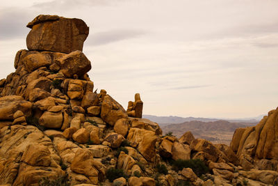 Rocks on mountain against sky