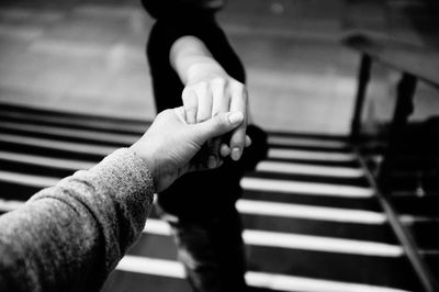 Close-up of couple holding hands