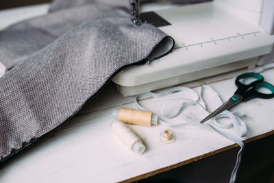 Sewing machine, accessories and fabric. cozy creative sewing process at home