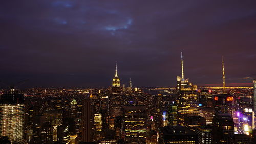 Illuminated buildings in city at night