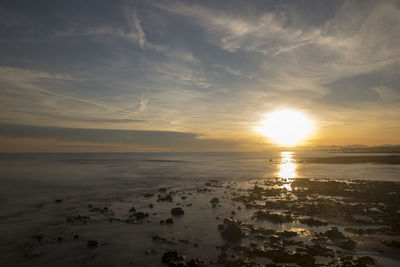 Scenic view of sea against sky during sunset