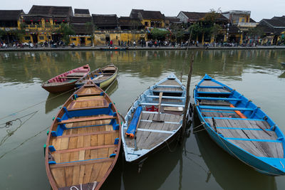 Boats moored in lake