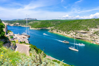 High angle view of sailboats on sea against sky