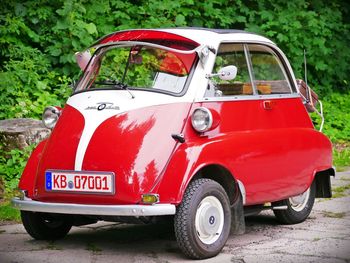 Red vintage car on street