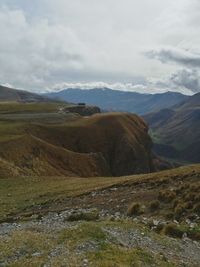 Scenic view of landscape and mountains against sky