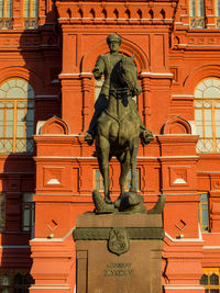 Low angle view of statue against building