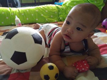 Portrait of boy playing soccer ball