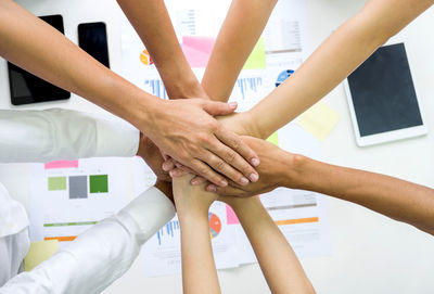 Low section of people with hands
