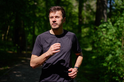 Portrait of young man standing outdoors