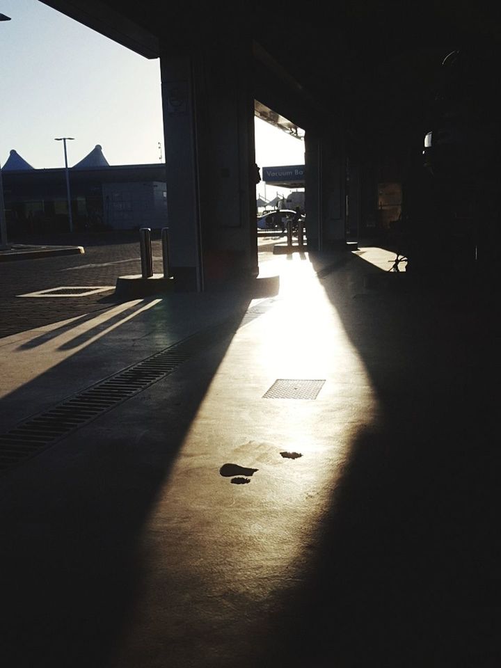 SUNLIGHT FALLING ON FLOOR IN BUILDING