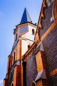 Low angle view of clock tower against sky