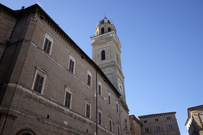 Low angle view of bell tower against sky