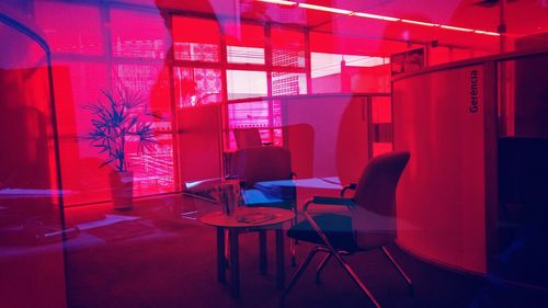 View of empty chairs in red room